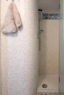 a bathroom with a shower with a sink at STELLA'S APARTMENT IN MONTI in Rome