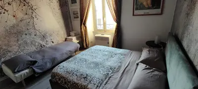 a bedroom with a bed and a window at Valentina Vatican Apartment in Rome