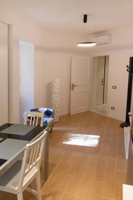 a living room with a table and a couch at Flaminio New Apartment in Rome