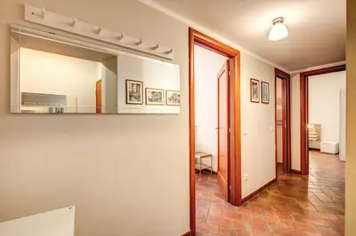 a room with a mirror and a hallway at Appartamenti - Via del Monte della Farina in Rome