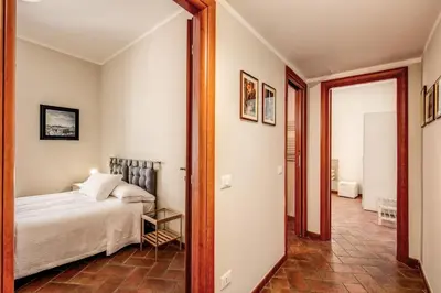 a bedroom with a bed and a mirror at Appartamenti - Via del Monte della Farina in Rome
