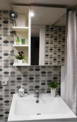 a bathroom with a sink and a mirror at La casetta di Josephine in Rome