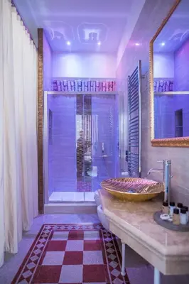 a bathroom with a large sink and a shower at Trastevere Royal Suite in Rome