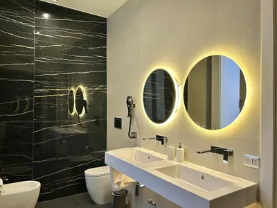 a yellow chair in a room with a mirror at Private Luxury Suites in Rome