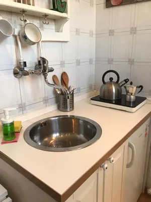 a kitchen counter with a sink in a kitchen at Attico incantevole, Pìgneto Roma in Rome