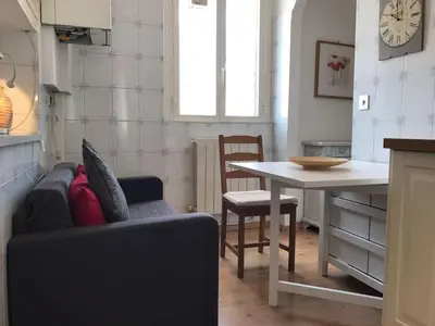 a living room with a couch and a table at Attico incantevole, Pìgneto Roma in Rome