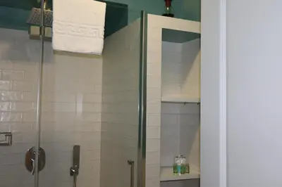 a shower with a glass door in a bathroom at Residenza Roma Imperiale in Rome