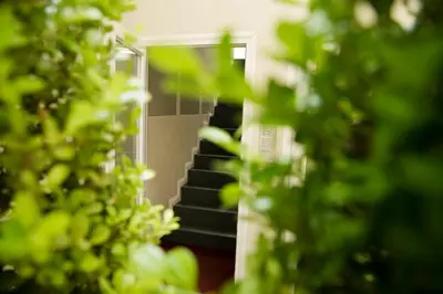 a reflection of a staircase in a mirror at Colosseo Suite Apartment in Rome