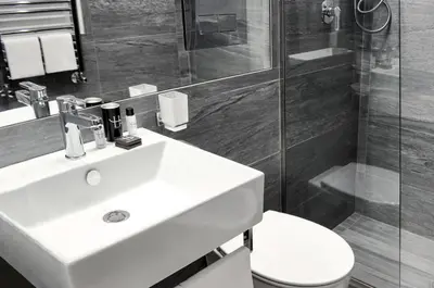 a bathroom with a sink and a shower and a toilet at LHP Suite Roma Termini in Rome
