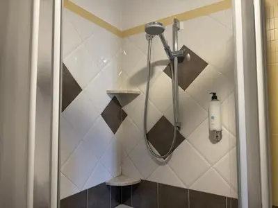 a shower in a bathroom with a glass door at Anthony House, Anthony Floor 3, Castro Pretorio in Rome