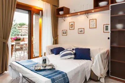 a living room with a couch and a table at Residenza il Parco 3 in Rome