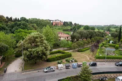 a view of a parking lot with cars parked at Residenza il Parco 3 in Rome