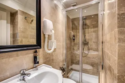 a bathroom with a sink and a shower at Hotel dei Quiriti Suite in Rome
