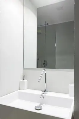 a bathroom with a white sink and a mirror at Vicoloft Vicolo in Rome