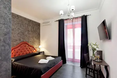 a bedroom with a bed and a window at Secret Rhome in Rome