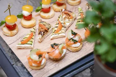 a bunch of sandwiches on a cutting board at UNA Hotels Empire Roma in Rome