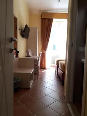 a small room with a desk and a window at Clodio Rooms in Rome