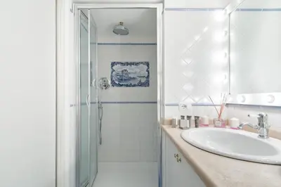 a bathroom with a sink and a shower at Leopardo 28 - Loft in Trastevere in Rome