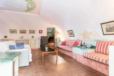 a dining room with a table and chairs at Piazza Colonna Apartment - Charme Holidays in Rome