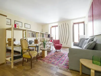 a living room with a couch and a table at Al Portico 39 Apartment in Rome