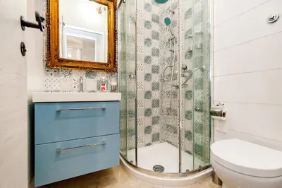 a bathroom with a shower and a toilet and a sink at Stop Colosseo in Rome
