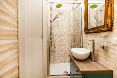 a bathroom with a sink and a shower at Stop Colosseo in Rome