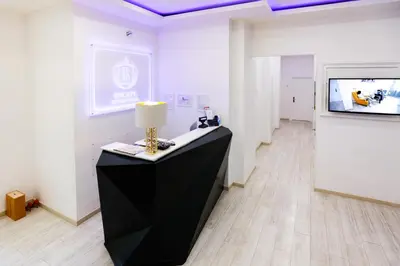 a room with a table with a lamp and a tv at Escape Luxury Suite - CA Domus Collection in Rome