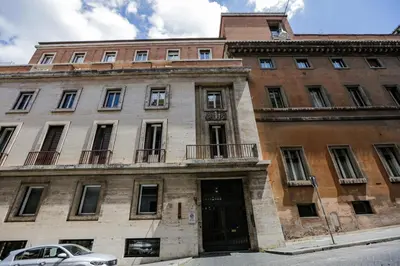 an old building with a car parked in front of it at Escape Luxury Suite - CA Domus Collection in Rome