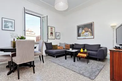 a living room with a couch and a table at Piazza Capponi Apartment in Rome