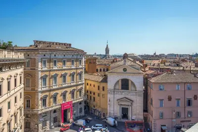 an aerial view of a city with buildings at Hotel Damaso in Rome