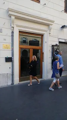 two people walking in front of a building at Luca's Vatican Hospitality in Rome