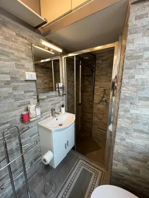 a bathroom with a sink and a shower at Luca's Vatican Hospitality in Rome