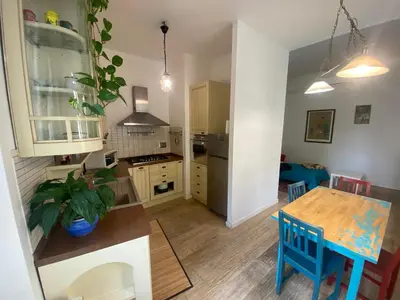 a kitchen with a table and a dining room at CASA CENEDA 46 in Rome