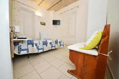 a room with a bedroom with a bed and a sink at stars luxury apartments in Rome