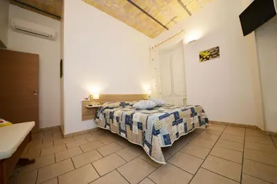a bedroom with a bed in a room at stars luxury apartments in Rome