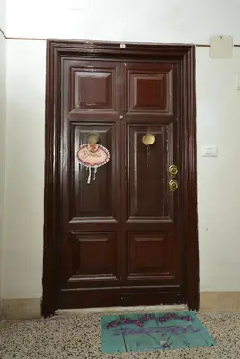 a brown door with a sticker on it at stars luxury apartments in Rome