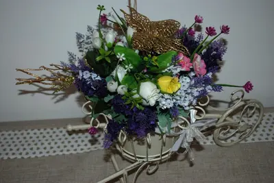 a bouquet of flowers in a basket on a table at stars luxury apartments in Rome