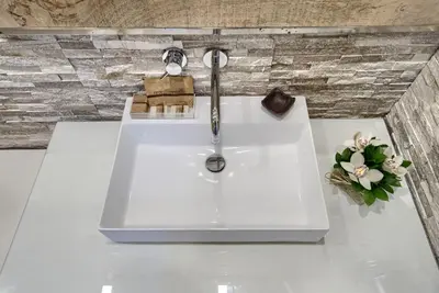 a bathroom sink with a faucet on a counter at Relais Vatican Secret in Rome