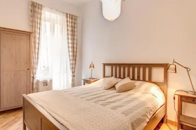 a bedroom with a bed and a window at Navona Flat di Elena & Paola in Rome