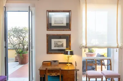 an office with a desk in a room at Rental in Rome - Fontana Di Trevi Penthouse in Rome