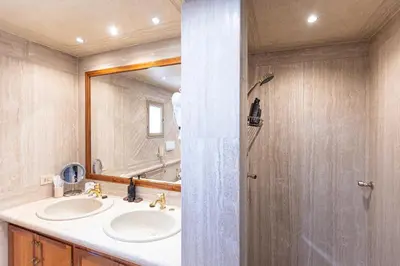 a bathroom with two sinks and a large mirror at Rental in Rome - Fontana Di Trevi Penthouse in Rome