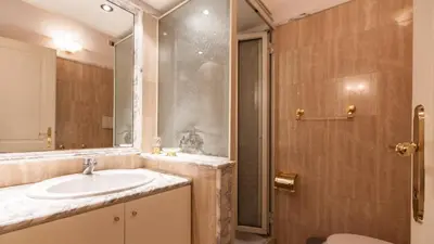 a bathroom with a sink and a shower at Rental in Rome - Gambero Suite in Rome