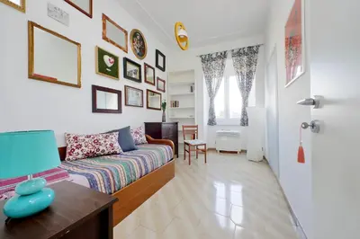 a living room with a couch and a table at Casa Rossi Roma in Rome