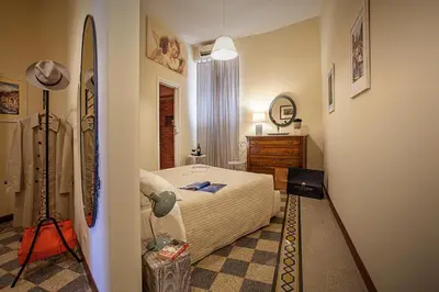 a bedroom with a bed and a surfboard in it at RomaAmor in Rome