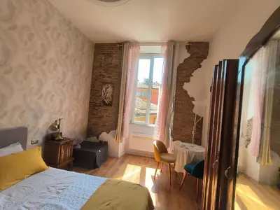 a bedroom with a bed and a large window at Marii Piazza Navona in Rome