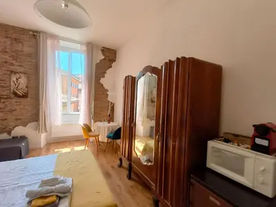 a bedroom with a dresser and a large mirror at Marii Piazza Navona in Rome