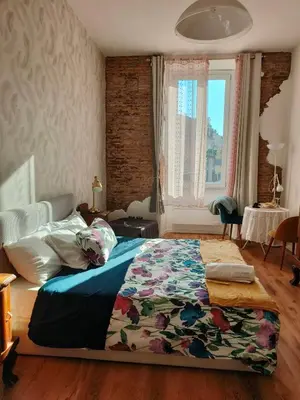 a bedroom with a large bed with a rug on it at Marii Piazza Navona in Rome