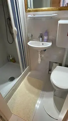 a small bathroom with a toilet and a sink at Marii Piazza Navona in Rome
