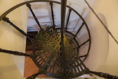 a close up of a metal chandelier at Moroni Trastevere Cozy Apartment in Rome