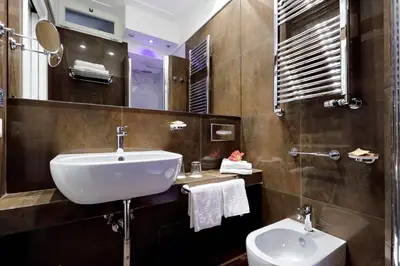 a bathroom with a sink and a toilet at Piazza Venezia Grand Suite in Rome